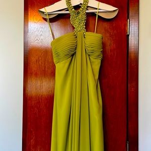 Full length chartreuse color gown with beaded neckline